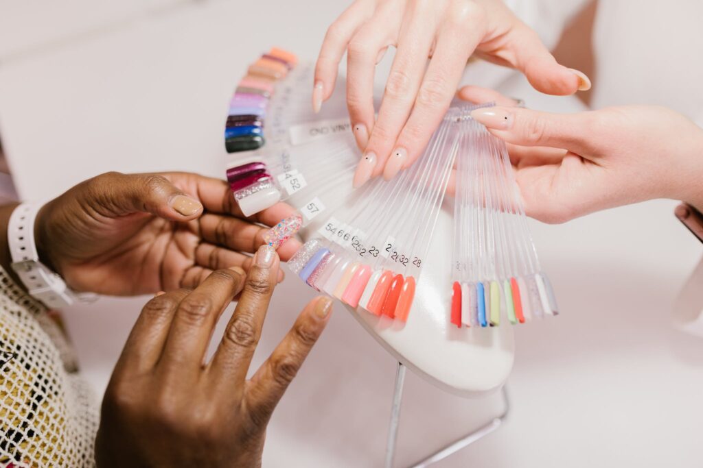 A Client Choosing on a Nail Color Palette